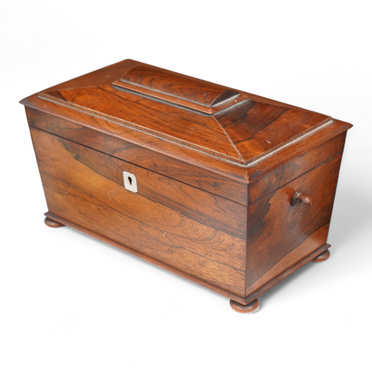 A William IV rosewood sarcophagus shaped tea caddy with glass liner, 33cm wide